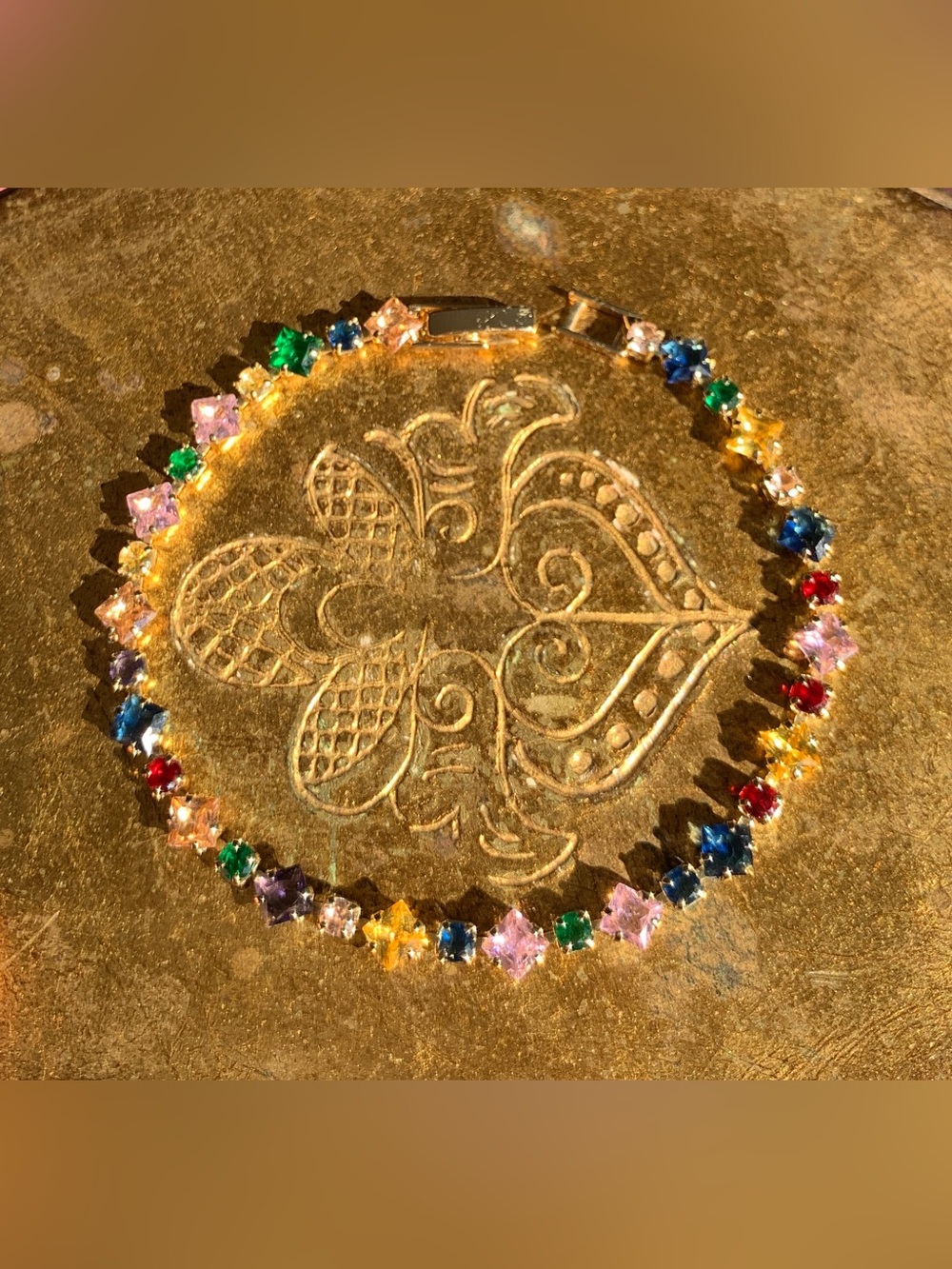 New Unworn multicoloured crystal bracelet, gold plate.